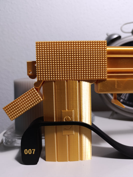 REPLICA DECORATIVA DE EXHIBICIÓN DE LA PISTOLA DE ORO DE JAMES BOND